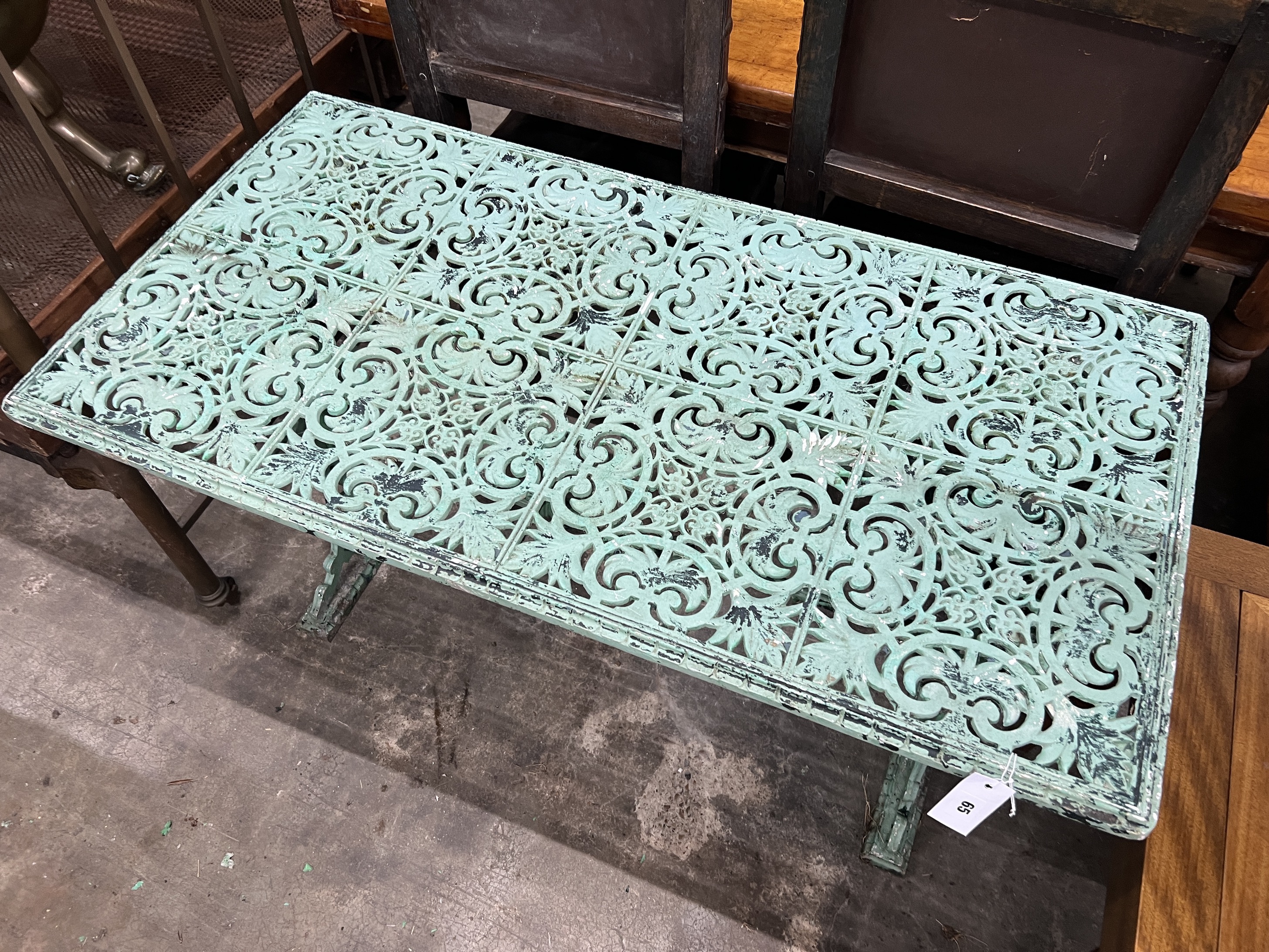 A Victorian style rectangular aluminium garden table, width 114cm, depth 58cm, height 69cm